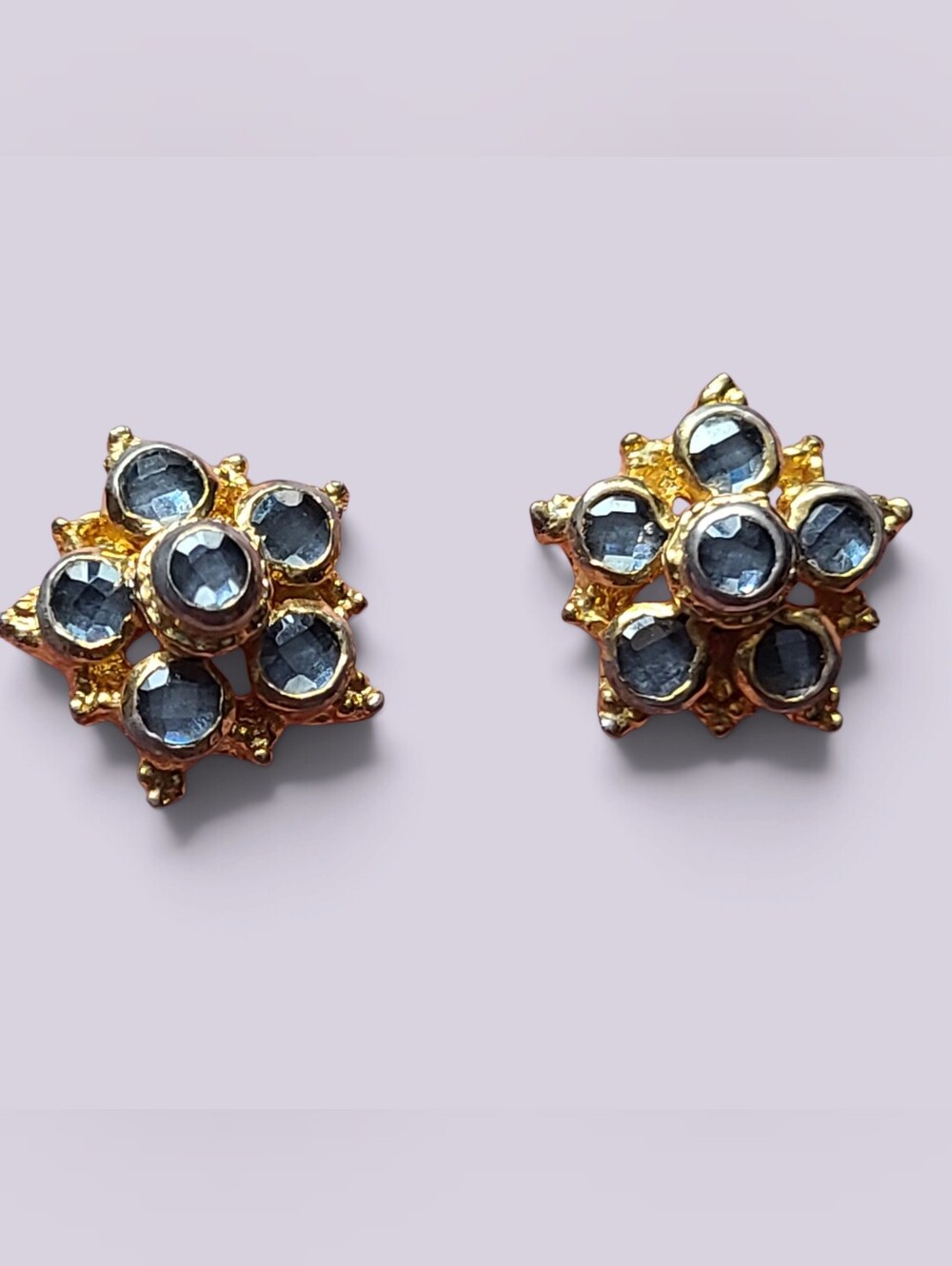 Gold-Tone Floral Stud Earrings with Blue Gem Accents